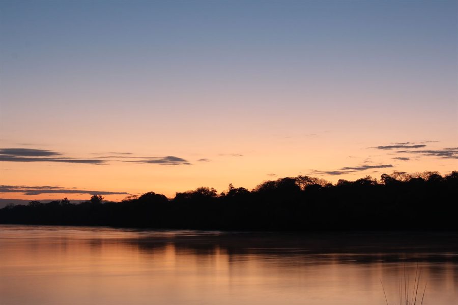 Sunset over a calm river in Zambia